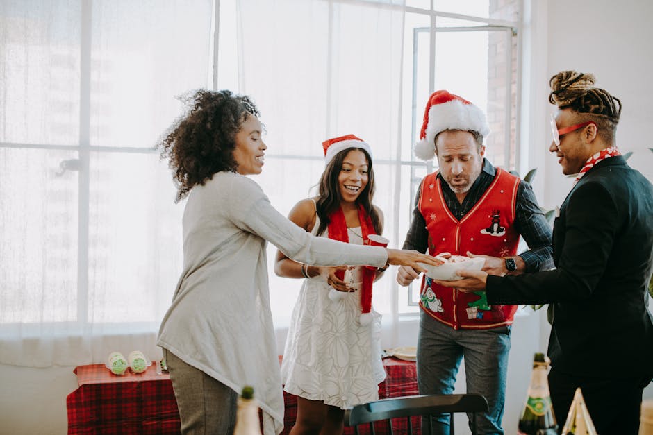 Cologne MICE events - Colleagues exchange gifts at a joyful office Christmas party. - Photo by RDNE Stock project